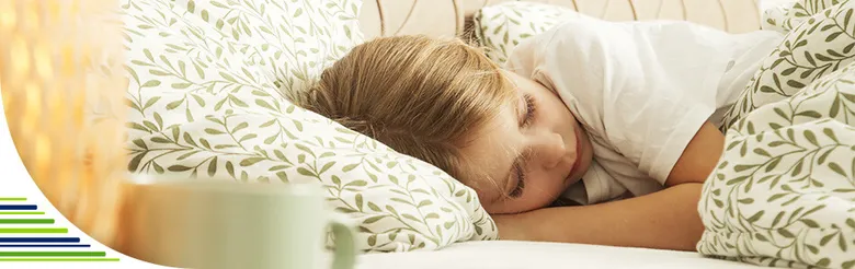 Sleeping child in bed