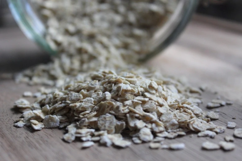 Oat flakes spilling from jar