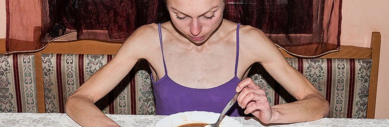 Woman eating soup