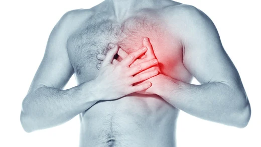 Man clutching chest in pain