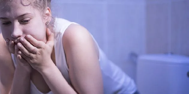 Woman in bathroom distress